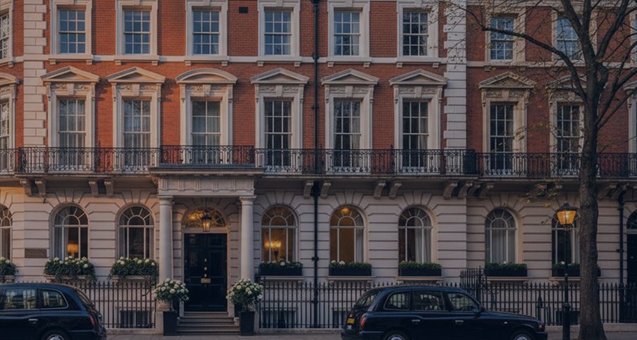 Stucco-fronted period terrace with iron railings, London